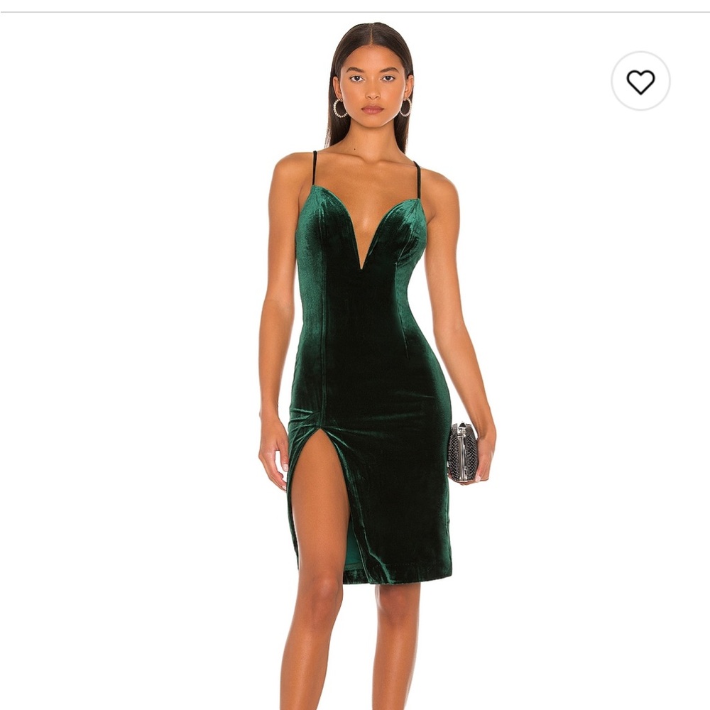 NBD emerald green velvet dress with deep v cleavage .
